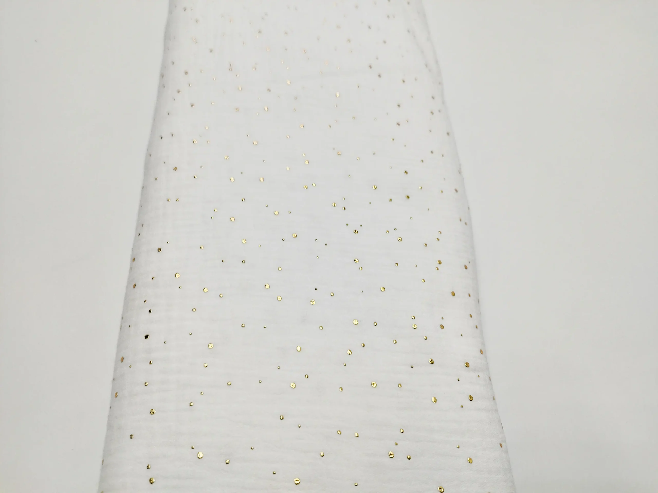 Tela principal Muselina blanca con puntos dorados